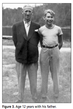 Age 12 years with his father.